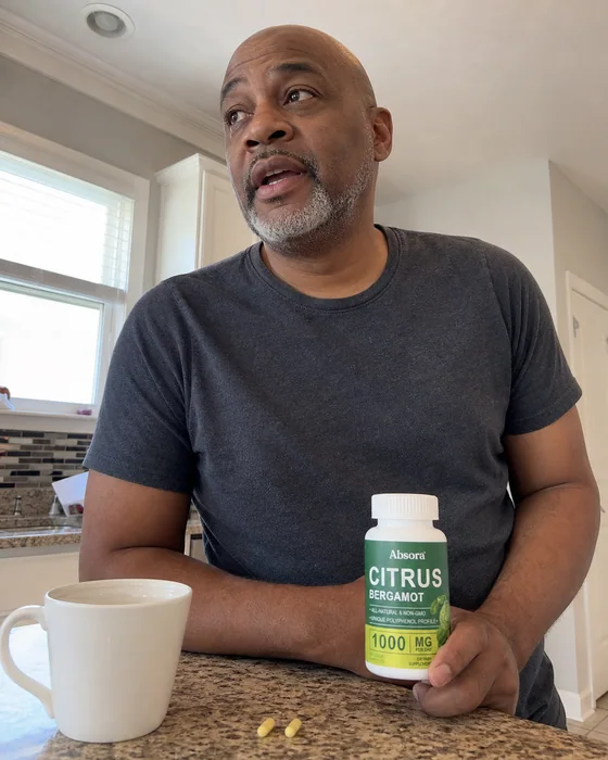 Man with Citrus Bergamot beside his morning coffee