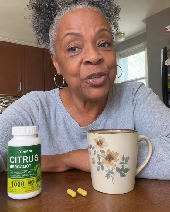 Woman sharing her Citrus Bergamot routine with a mug