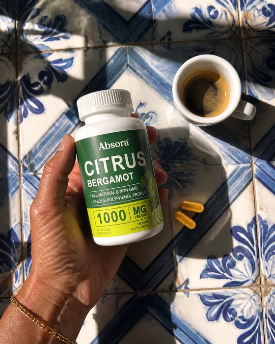 Citrus Bergamot, capsules and coffee on patterned tiles