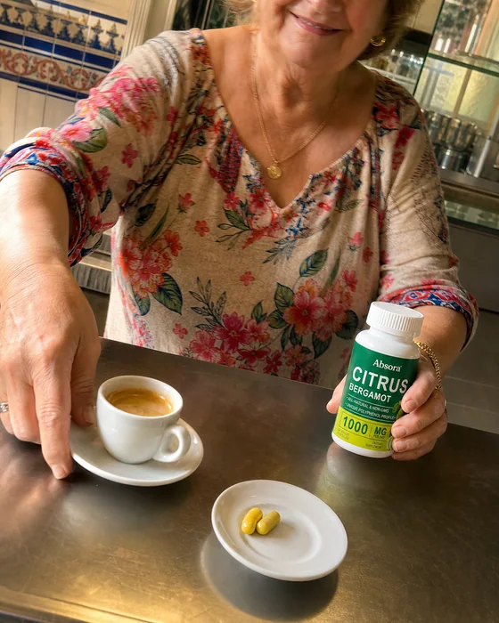Woman taking Citrus Bergamot during a coffee break
